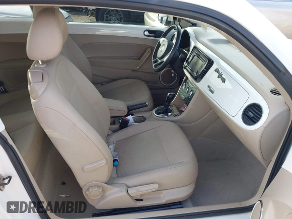 2014 Volkswagen Beetle 2.5L w/Sun with VIN 3VWJP7ATXEM628666, listed as a IAAI auction lot 41328014 with 70,990 mi miles and . Bid and sale history available at DreamBid. Image 5.