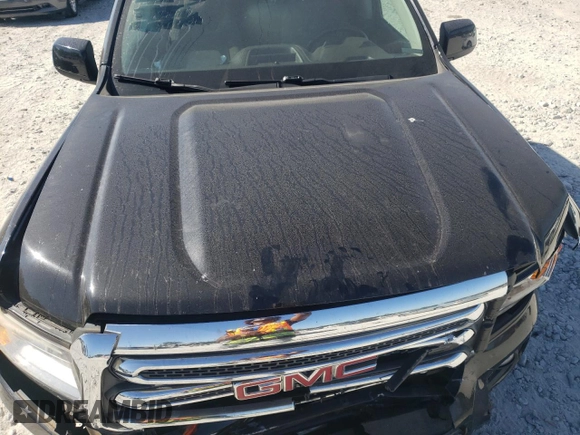 2015 GMC Canyon 2WD SLE with VIN 1GTG5BEA6F1221120, listed as a Copart auction lot 77391484 with 180,334 mi miles and Salvage Title. Bid and sale history available at carsss.com. Image 11.