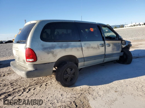 1999 Plymouth Voyager Grand SE z VIN 1P4GP44G1XB579504, wystawiony jako Copart lot #50064475 z przebiegiem Nie podano mil oraz Nie do naprawy. Historia ofert i sprzedaży dostępna na DreamBid. Obrazek 3.