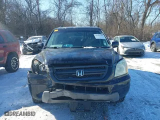 2004 Honda Pilot EX with VIN 2HKYF18544H574133, listed as a IAAI auction lot 41415703 with 217,539 mi miles. Bid and sale history available at carsss.com. Image 12.