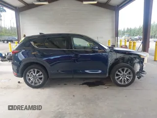 2019 Mazda CX-5 Grand Touring with VIN JM3KFBDM6K0522903, listed as a IAAI auction lot 42583005 with 61,174 mi miles and . Bid and sale history available at DreamBid. Image 14.