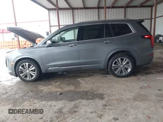 2022 Cadillac XT6 Premium Luxury z VIN 1GYKPDRS1NZ108012, wystawiony jako IAAI lot #41178333 z przebiegiem 83 987 mil mil oraz . Historia ofert i sprzedaży dostępna na DreamBid. Obrazek 14.