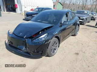 2025 Tesla Model Y Long Range with VIN 7SAYGDEEXSF267888, listed as a IAAI auction lot 41807129 with 3,002 mi miles and . Bid and sale history available at DreamBid. Image 2.