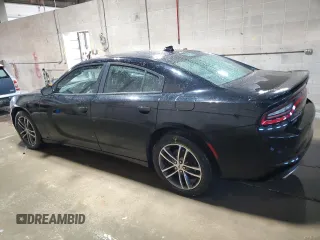 2019 Dodge Charger SXT with VIN 2C3CDXJG1KH757949, listed as a Copart auction lot 82231714 with 75,985 mi miles and Salvage Title. Bid and sale history available at DreamBid. Image 2.