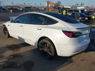 2018 Tesla Model 3 Long Range Battery with VIN 5YJ3E1EB0JF092440, listed as a IAAI auction lot 41881209 with 74,818 mi miles. Bid and sale history available at carsss.com. Image 3.