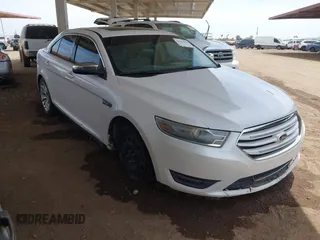2013 Ford Taurus Limited z VIN 1FAHP2F80DG217154, wystawiony jako IAAI lot #42363373 z przebiegiem 165 572 mil mil oraz . Historia ofert i sprzedaży dostępna na DreamBid. Obrazek 1.