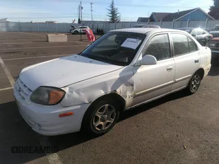 2004 Hyundai Accent GL with VIN KMHCG45C04U498939, listed as a IAAI auction lot 41384821 with 247,994 mi miles. Bid and sale history available at carsss.com. Image 2.