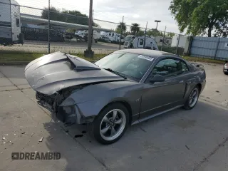 2003 Ford Mustang GT Deluxe with VIN 1FAFP42X83F305311, listed as a Copart auction lot 52990965 with 85,907 mi miles and Salvage title. Bid and sale history available at DreamBid. Image 1.