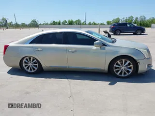 2014 Cadillac XTS Premium with VIN 2G61P5S33E9157607, listed as a IAAI auction lot 42004612 with 111,047 mi miles and . Bid and sale history available at DreamBid. Image 13.