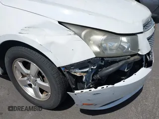 2014 Chevrolet Cruze 1LT with VIN 1G1PC5SB4E7132171, listed as a IAAI auction lot 42532531 with 132,012 mi miles and . Bid and sale history available at DreamBid. Image 14.