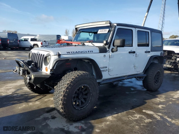2012 Jeep Wrangler Unlimited Sport with VIN 1C4BJWDG5CL172074, listed as a Copart auction lot 84883964 with 112,006 mi miles and Salvage Title. Bid and sale history available at carsss.com. Image 1.