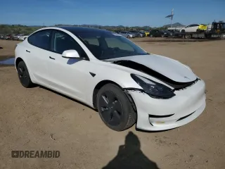 2023 Tesla Model 3 with VIN 5YJ3E1EA6PF423070, listed as a Copart auction lot 52029985 with 19,541 mi miles and Salvage Title. Bid and sale history available at DreamBid. Image 4.