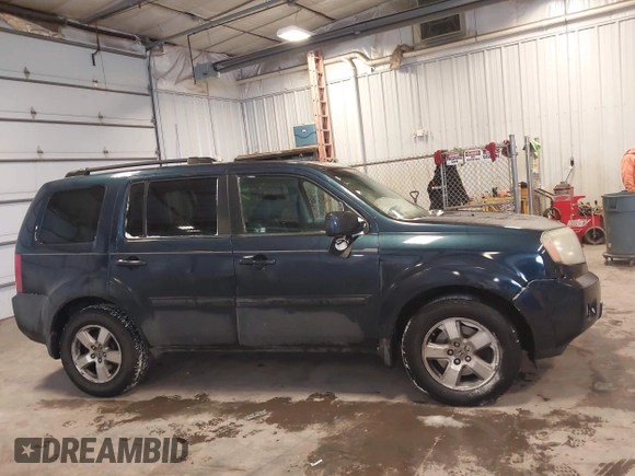 2009 Honda Pilot EX-L with VIN 5FNYF48579B044150, listed as a IAAI auction lot 41568792 with 244,763 mi miles. Bid and sale history available at carsss.com. Image 13.