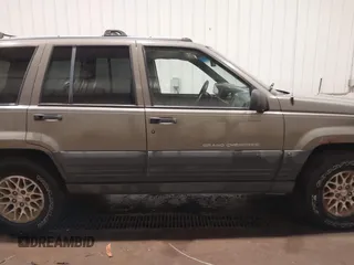 1996 Jeep Grand Cherokee Laredo with VIN 1J4GZ58S5TC182766, listed as a IAAI auction lot 41372356 with 234,390 mi miles. Bid and sale history available at carsss.com. Image 14.