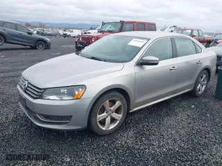 2014 Volkswagen Passat Wolfsburg Ed with VIN 1VWAT7A33EC060225, listed as a IAAI auction lot 41818949 with 163,545 mi miles. Bid and sale history available at carsss.com. Image 2.