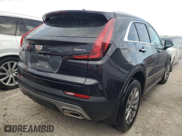 2022 Cadillac XT4 FWD Premium Luxury z VIN 1GYFZCR44NF166169, wystawiony jako Copart lot #77981414 z przebiegiem 9 734 mil mil oraz Nie do naprawy • Non repairable. Historia ofert i sprzedaży dostępna na DreamBid. Obrazek 3.