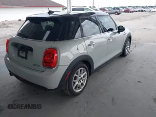 2019 MINI Hardtop 4 Door Cooper z VIN WMWXU1C59K2J02305, wystawiony jako IAAI lot #42205461 z przebiegiem 75 101 mil mil oraz . Historia ofert i sprzedaży dostępna na DreamBid. Obrazek 4.