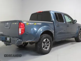 2014 Nissan Frontier SV with VIN 1N6AD0ERXEN763554, listed as a Copart auction lot 64313295 with 109,756 mi miles and Salvage title. Bid and sale history available at DreamBid. Image 3.