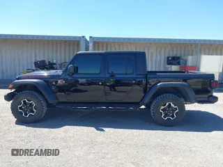 2023 Jeep Gladiator Rubicon z VIN 1C6JJTBG3PL531982, wystawiony jako IAAI lot #42211139 z przebiegiem 28 301 mil mil oraz . Historia ofert i sprzedaży dostępna na DreamBid. Obrazek 14.