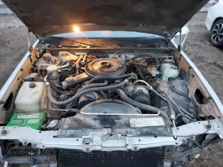 1987 Chevrolet El Camino z VIN 3GCCW80H1HS905822, wystawiony jako Copart lot #83686744 z przebiegiem 83 492 mil mil oraz Szkoda całkowita • Salvage title. Historia ofert i sprzedaży dostępna na DreamBid. Obrazek 11.