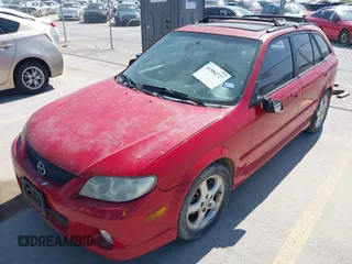 2002 Mazda Protege with VIN JM1BJ246721565634, listed as a IAAI auction lot 41984727 with 235,764 mi miles and . Bid and sale history available at DreamBid. Image 2.