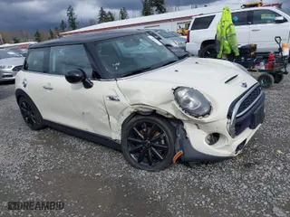 2016 MINI Cooper Hardtop S with VIN WMWXP7C59G2A42935, listed as a IAAI auction lot 41910245 with 106,154 mi miles. Bid and sale history available at carsss.com. Image 1.