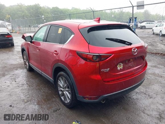 2019 Mazda CX-5 Grand Touring with VIN JM3KFBDM8K0693622, listed as a IAAI auction lot 42503818 with 60,812 mi miles and . Bid and sale history available at DreamBid. Image 3.