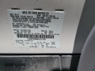 2014 Ford Taurus Limited with VIN 1FAHP2F84EG121559, listed as a Copart auction lot 61764825 with 82,548 mi miles and Salvage title. Bid and sale history available at DreamBid. Image 12.