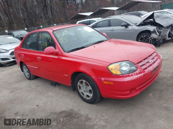 2005 Hyundai Accent GLS with VIN KMHCG45CX5U614083, listed as a IAAI auction lot 41006582 with 72,516 mi miles. Bid and sale history available at carsss.com. Image 1.