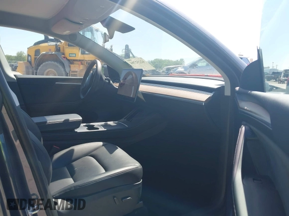 2023 Tesla Model Y Long Range with VIN 7SAYGDEE4PA037218, listed as a IAAI auction lot 42232704 with 18,756 mi miles and . Bid and sale history available at DreamBid. Image 5.