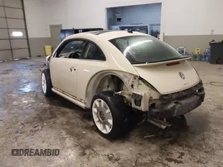 2019 Volkswagen Beetle S with VIN 3VWFD7ATXKM705322, listed as a IAAI auction lot 41409600 with 97,479 mi miles. Bid and sale history available at carsss.com. Image 3.