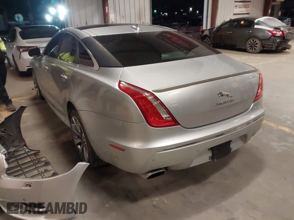 2015 Jaguar XJ with VIN SAJWA1CZ8F8V83873, listed as a IAAI auction lot 41271111 with 94,830 mi miles. Bid and sale history available at carsss.com. Image 3.