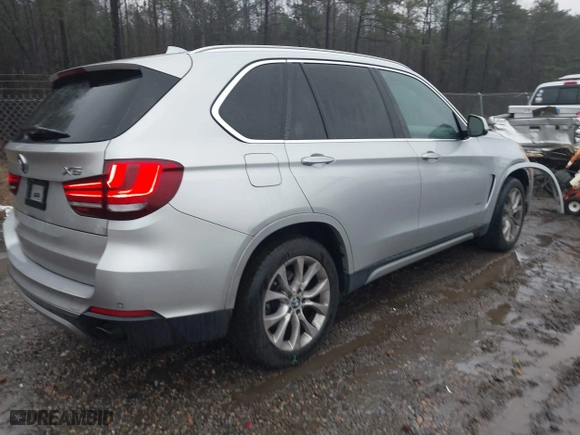 2015 BMW X5 xDrive35d with VIN 5UXKS4C51F0N06221, listed as a IAAI auction lot 41568976 with 162,442 mi miles. Bid and sale history available at carsss.com. Image 4.