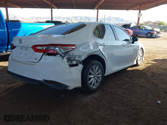 2020 Toyota Camry LE with VIN 4T1C11AK7LU401666, listed as a IAAI auction lot 41865235 with 69,189 mi miles. Bid and sale history available at carsss.com. Image 4.
