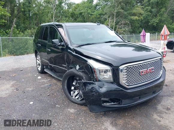 2016 GMC Yukon Denali with VIN 1GKS1CKJXGR254306, listed as a IAAI auction lot 39953539 with 164,149 mi miles. Bid and sale history available at carsss.com. Image 1.