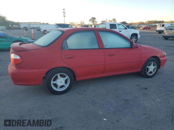 2001 Kia Sephia z VIN KNAFB121715066725, wystawiony jako Copart lot #86552964 z przebiegiem 76 915 mil mil oraz Tytuł czysty. Historia ofert i sprzedaży dostępna na DreamBid. Obrazek 3.