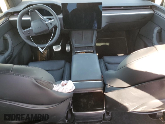 2023 Tesla Model X with VIN 7SAXCDE5XPF422163, listed as a Copart auction lot 52573185 with Not Provided miles and Salvage Title. Bid and sale history available at DreamBid. Image 8.