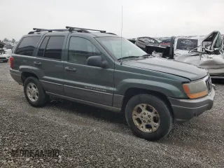 2002 Jeep Grand Cherokee z VIN 1J4GX38S72C152046, wystawiony jako Copart lot #57963095 z przebiegiem 204 576 mil mil oraz Szkoda całkowita • Salvage title. Historia ofert i sprzedaży dostępna na DreamBid. Obrazek 4.