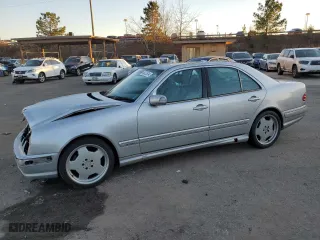 2000 Mercedes-Benz E-Class with VIN WDBJF70JXYB113988, listed as a Copart auction lot 86325514 with 198,321 mi miles and Salvage Title. Bid and sale history available at carsss.com. Image 1.