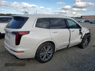 2020 Cadillac XT6 FWD Premium Luxury with VIN 1GYKPCRS2LZ138465, listed as a Copart auction lot 76114034 with 57,353 mi miles and Salvage Title. Bid and sale history available at carsss.com. Image 3.