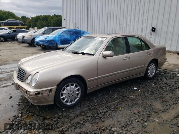 2001 Mercedes-Benz E-Class with VIN WDBJF65J01B389296, listed as a Copart auction lot 71933404 with 124,392 mi miles and Salvage Title. Bid and sale history available at carsss.com. Image 1.