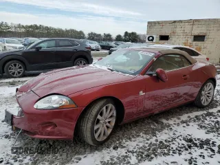 2007 Jaguar XK with VIN SAJWA44B575B18704, listed as a Copart auction lot 86154354 with 104,711 mi miles and Salvage Title. Bid and sale history available at carsss.com. Image 1.