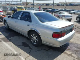 2003 Cadillac Seville Luxury SLS z VIN 1G6KS54Y43U214795, wystawiony jako IAAI lot #42348542 z przebiegiem 144 438 mil mil oraz . Historia ofert i sprzedaży dostępna na DreamBid. Obrazek 3.