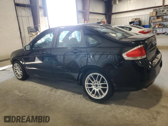 2009 Ford Focus SES with VIN 1FAHP36N49W189173, listed as a Copart auction lot 61967564 with 82,587 mi miles and Salvage Title. Bid and sale history available at carsss.com. Image 2.