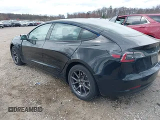 2021 Tesla Model 3 Long Range with VIN 5YJ3E1EB4MF012822, listed as a IAAI auction lot 41918721 with 69,105 mi miles. Bid and sale history available at carsss.com. Image 3.