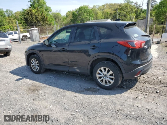 2015 Mazda CX-5 Touring with VIN JM3KE4CY6F0434538, listed as a Copart auction lot 54966145 with 209,447 mi miles and Clean Title. Bid and sale history available at DreamBid. Image 2.