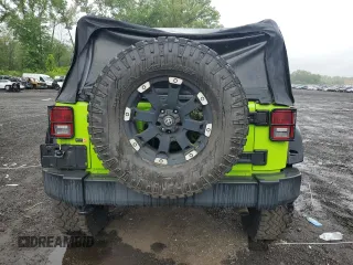 2012 Jeep Wrangler Sport with VIN 1C4AJWAG2CL233722, listed as a Copart auction lot 61125095 with 49,864 mi miles and Salvage title. Bid and sale history available at DreamBid. Image 6.