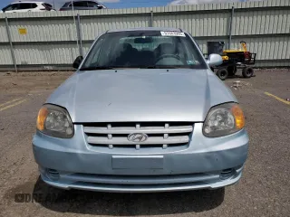 2004 Hyundai Accent GL z VIN KMHCG45C94U574027, wystawiony jako Copart lot #57463905 z przebiegiem 139 595 mil mil oraz Szkoda całkowita • Salvage title. Historia ofert i sprzedaży dostępna na DreamBid. Obrazek 5.