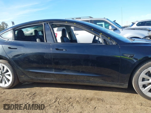 2022 Tesla Model 3 with VIN 5YJ3E1EA9NF295890, listed as a IAAI auction lot 41175917 with 42,230 mi miles and . Bid and sale history available at DreamBid. Image 14.