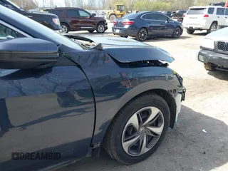 2021 Honda Civic LX z VIN 19XFC2F65ME000324, wystawiony jako IAAI lot #42137375 z przebiegiem 78 473 mil mil oraz . Historia ofert i sprzedaży dostępna na DreamBid. Obrazek 19.